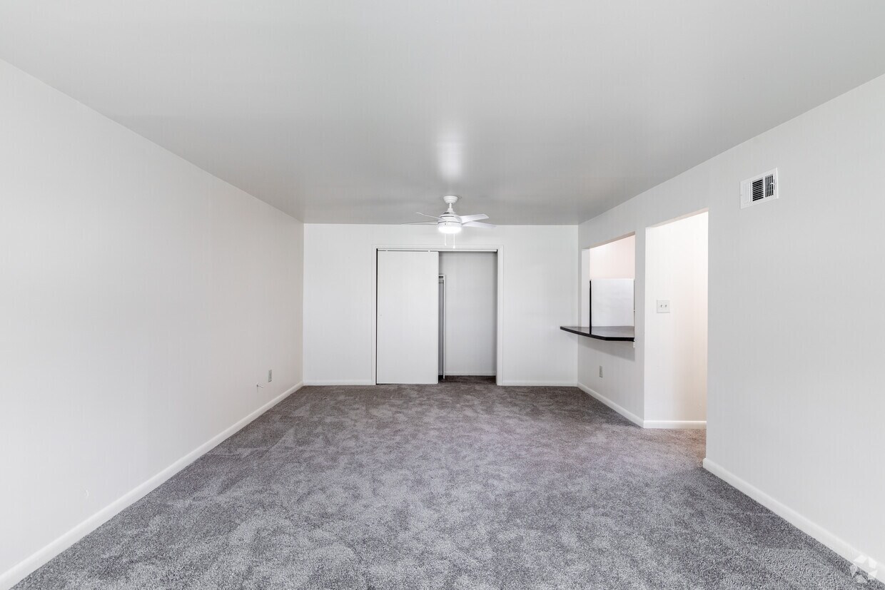 Dining area and pass-through kitchen in an Emerald Pond Estates two-bedroom apartment