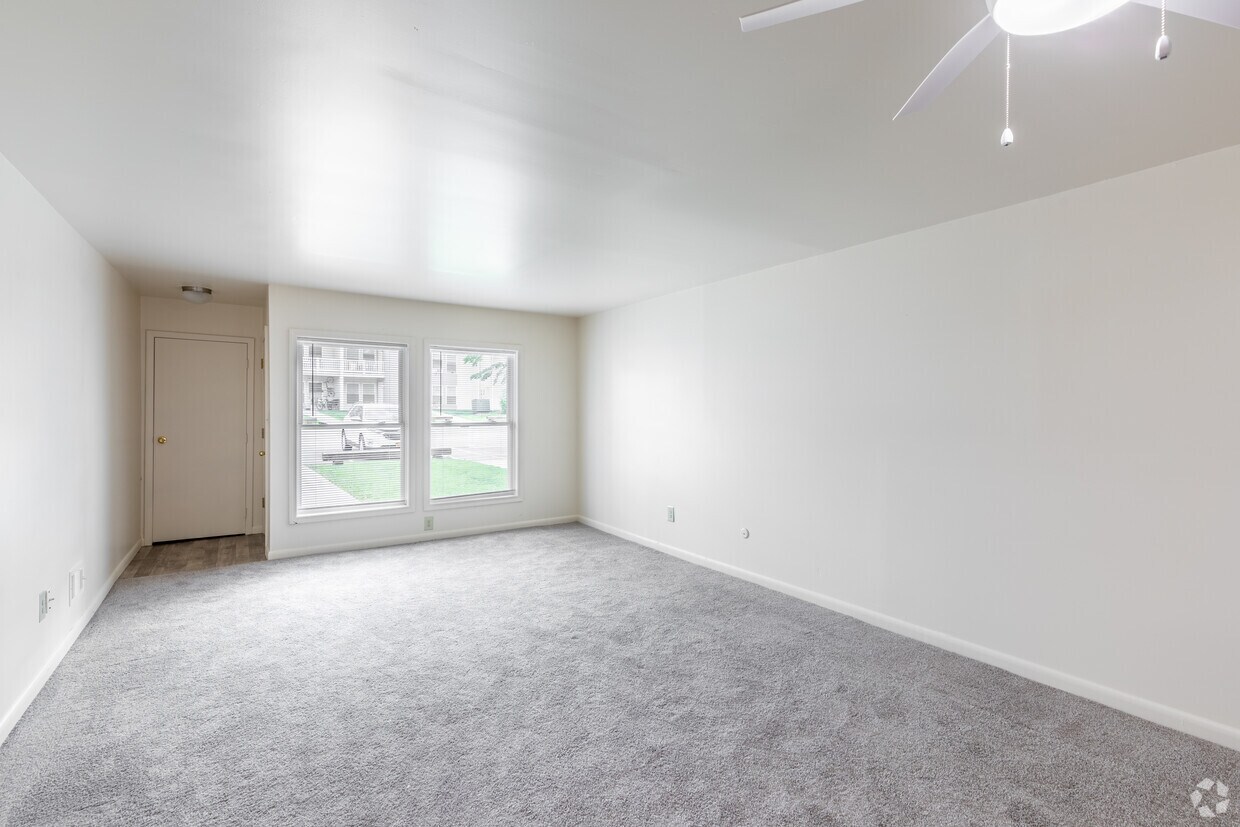 Large living room with natural light in an Emerald Pond Estates two-bedroom apartment